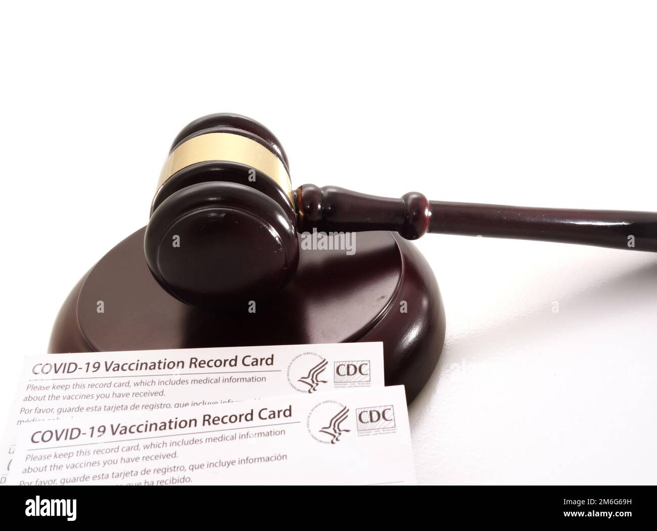 Legal gavel and US CDC COVID-19 Vaccination Record card Stock Photo