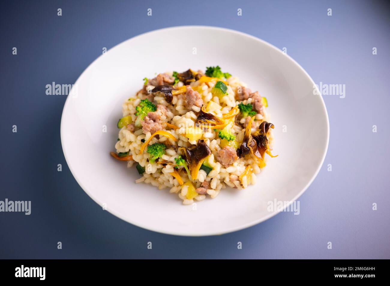 Risotto with mushrooms and vegetables. Risotto is a northern Italian