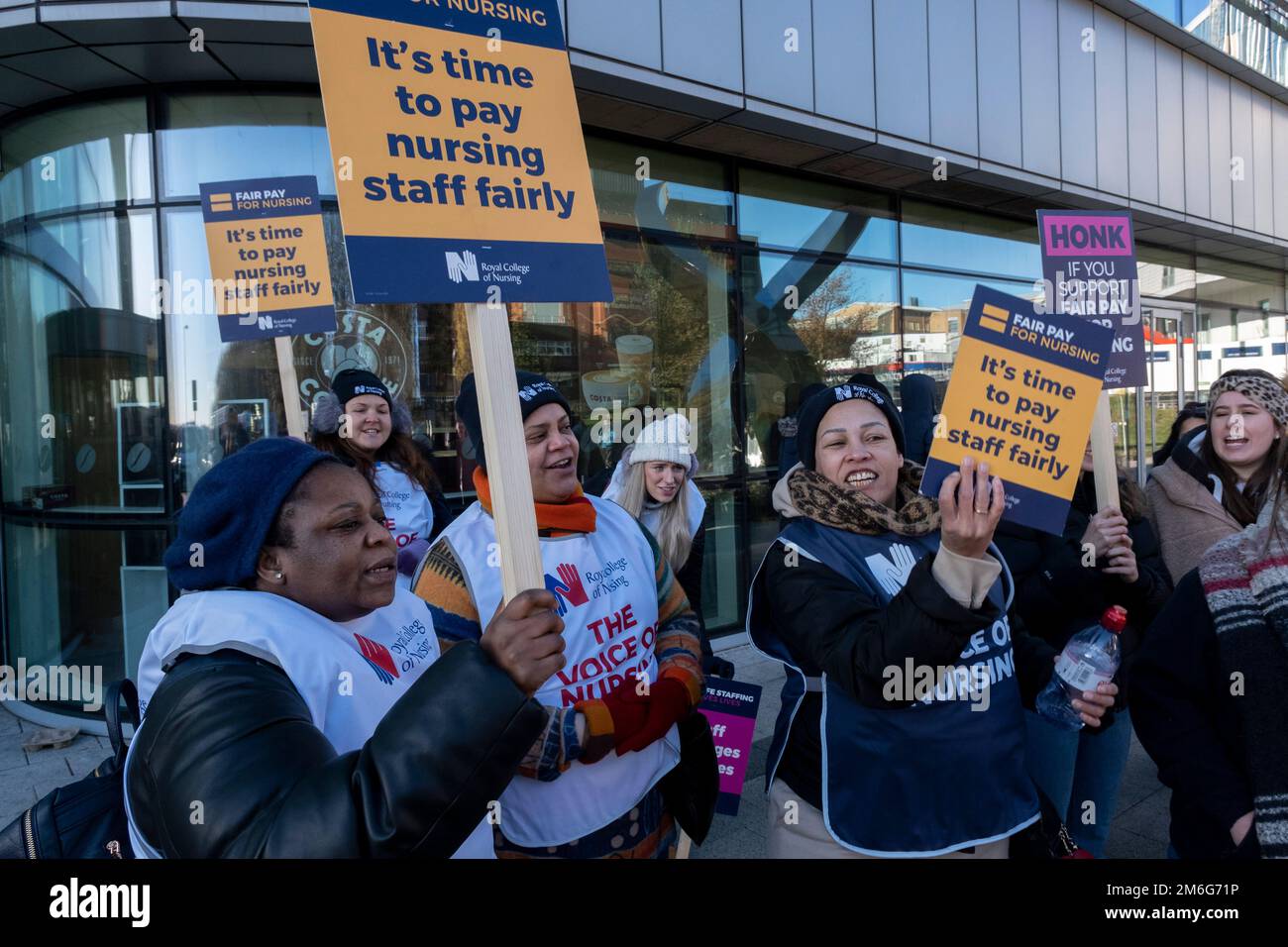 Nurses from the Royal College of Nursing strike for fair pay and working conditions in unprecedented industrial action by nurses outside the Queen Elizabeth Hospital on 15th December 2022 in Birmingham, United Kingdom. This is the first of two planned strikes before the end of the year, with the dispute possibly heading for more in the New Year if the government fails to improve their offer. Stock Photo