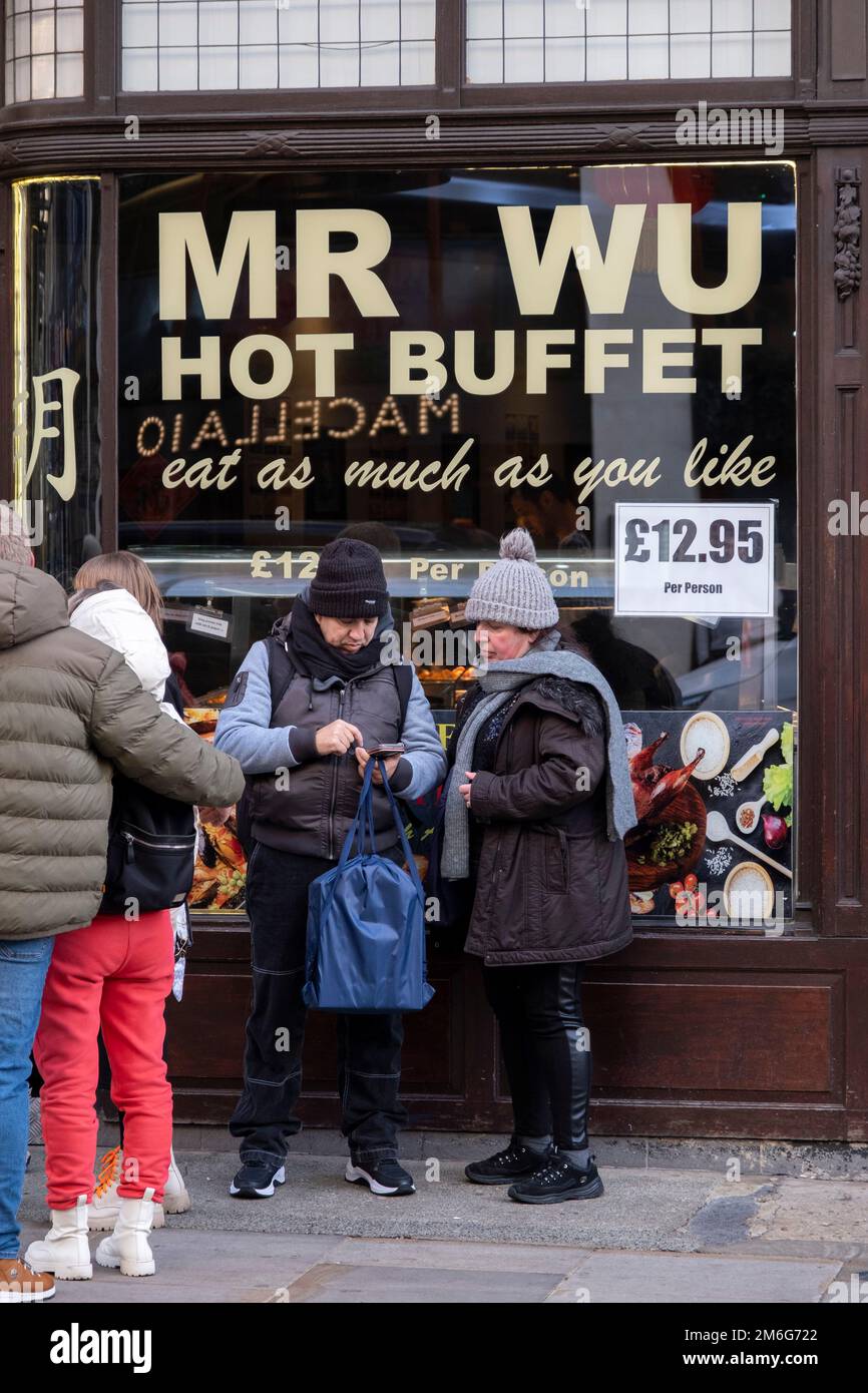 Mr Wu Eat as much as you like Chinese hot buffet style restaurant in Chinatown on 6th December 2022 in London, United Kingdom. Many people eat bargain food responsibly and it provides great value for consumers, however concerns over obesity levels in the UK remain, especially with foods containing high levels of fat and sugar. Obesity is a medical condition in which excess body fat has accumulated to the extent that it may have a negative effect on health. Stock Photo