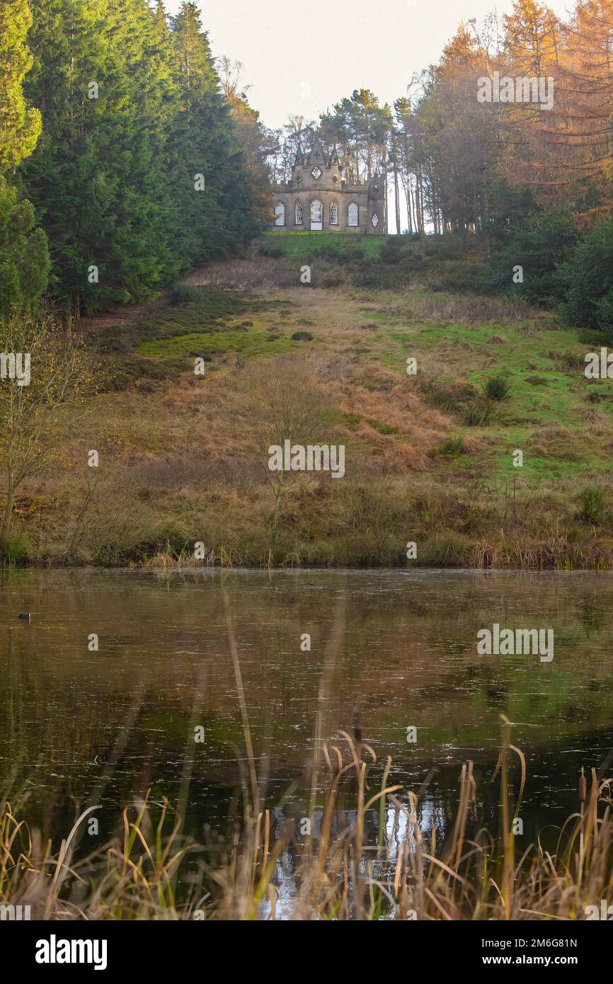Banqueting House, a gothic style building overlooking a large pond on