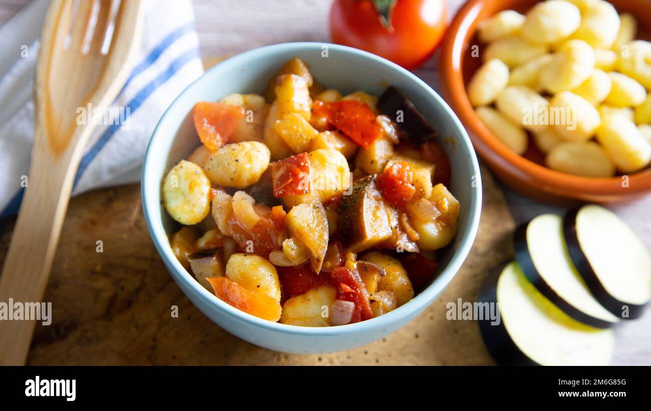 Sautéed gnocchi with grilled vegetables. Typical Italian recipe Stock