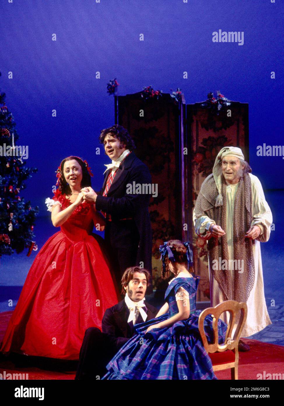 rear, l-r: Sara Weymouth (Fred's wife), Philip Quast (Fred), Clive Francis (Ebenezer Scrooge) in A CHRISTMAS CAROL by Charles Dickens at the Royal Shakespeare Company (RSC), Barbican Theatre, Barbican Centre, London EC2  28/11/1994   adapted by John Mortimer  music: Nigel Hess  set design: John Gunter  costumes: Deirdre Clancy  lighting: Nigel Levings  choreography: Lindsay Dolan  director: Ian Judge Stock Photo