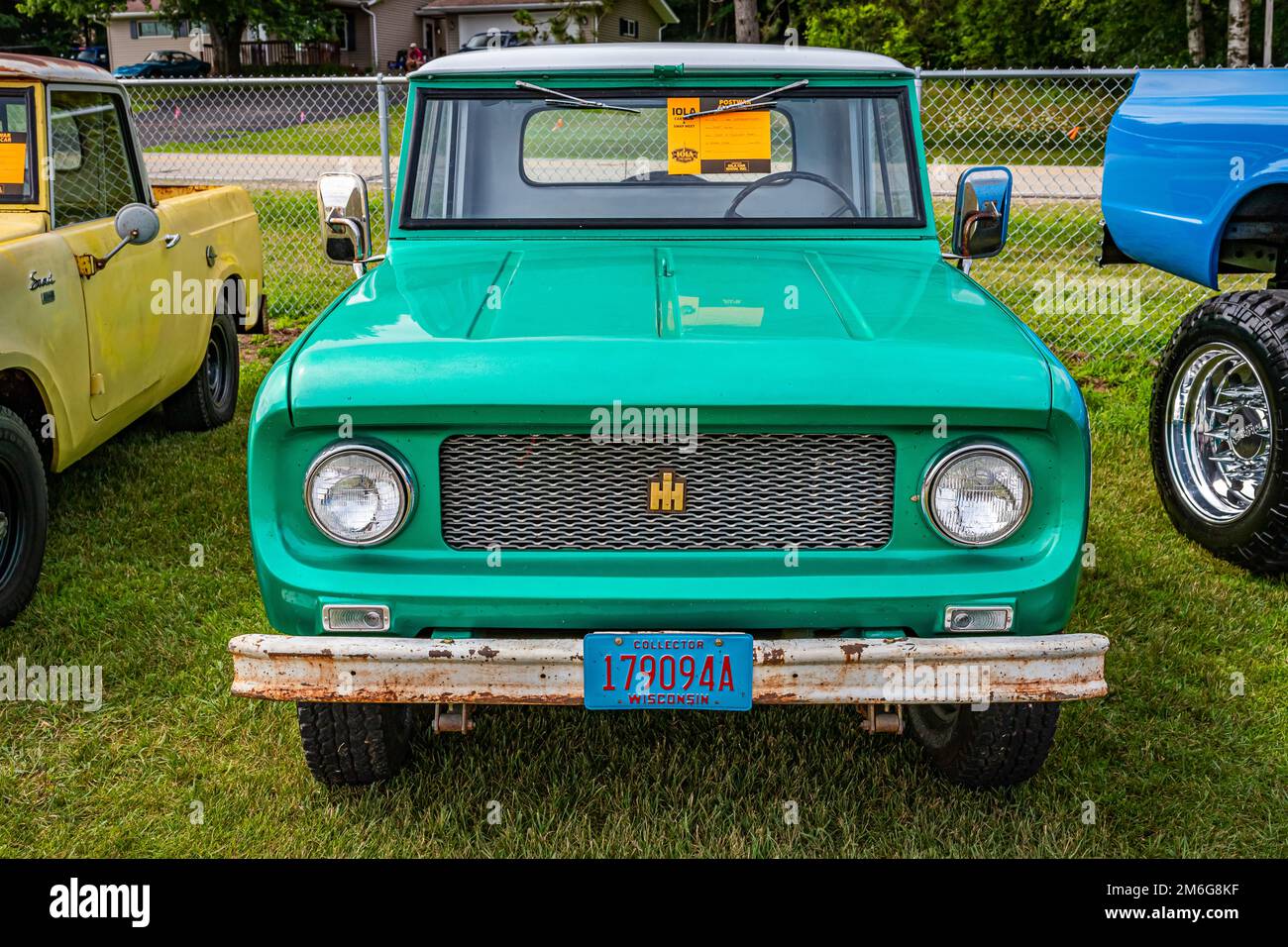 Iola, WI - July 07, 2022: High perspective front view of a 1961 International Harvester Scout 80 Pickup at a local car show. Stock Photo