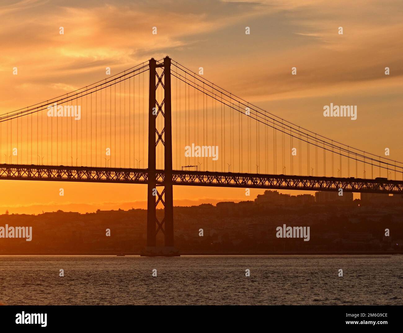 Evening mood at the April 25th Bridge in Lisbon - Portugal Stock Photo