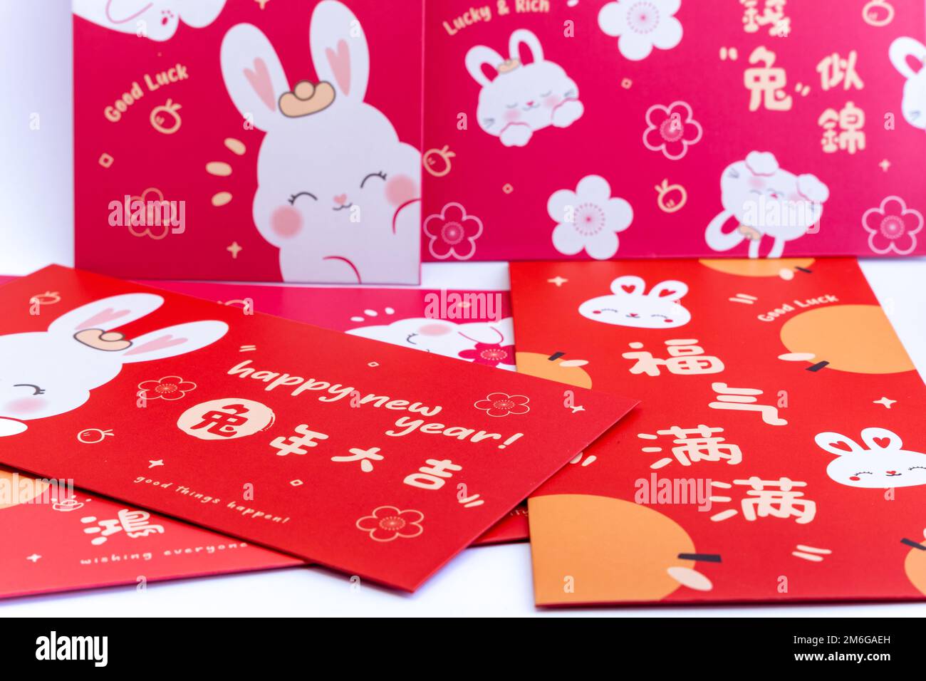 Chinese red envelope. Chinese new year concept background . Translation on red envelope: 'Happy New Year of Rabbit' Stock Photo