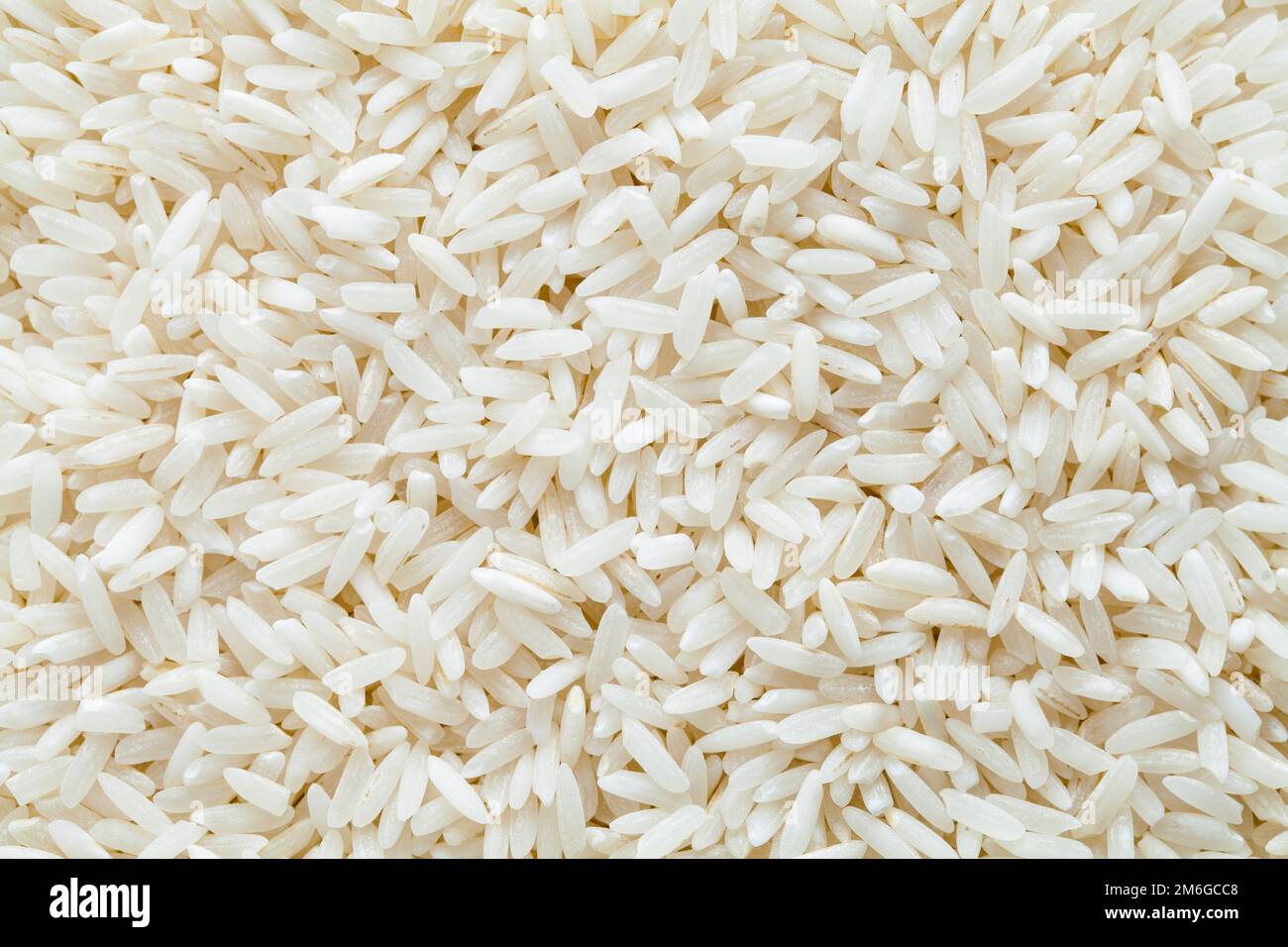 Close Up of a Pile of Rice Background Texture. Stock Photo