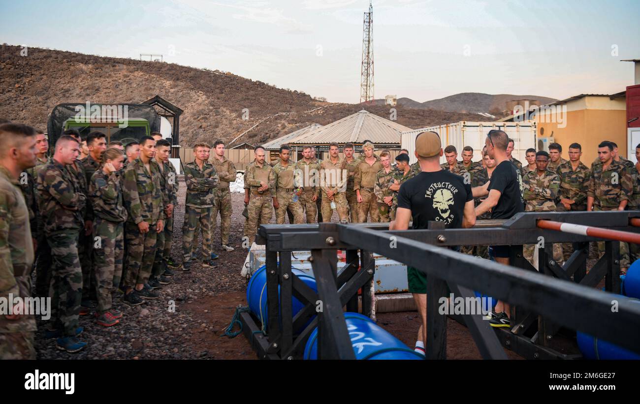 U.S. service members with the Combined Joint Task Force – Horn of Africa (CJTF-HOA) participate in the French Desert Commando Course (FDCC) at Arta Range, Djibouti, April 27, 2022. Since 2015, the French Forces stationed in Djibouti (FFDJ) have invited U.S. service members with CJTF-HOA or deployed to Camp Lemonnier to participate in the course. Members of the CJTF HOA regularly train and work alongside allies, partners, and government organizations to achieve a unified effort to improve safety, security and prosperity in East Africa. Stock Photo