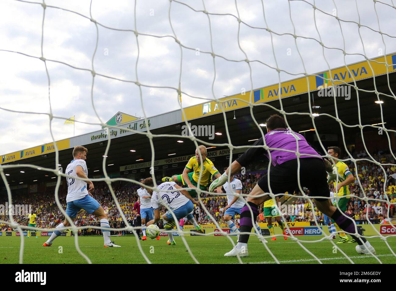Steven Naismith of Norwich City goes to ground in the penalty area after a challenge from Sam Hutchinson of Sheffield Wednesday - Norwich City v Sheffield Wednesday, Sky Bet Championship, Carrow Road, Norwich - 13th August 2016. Stock Photo
