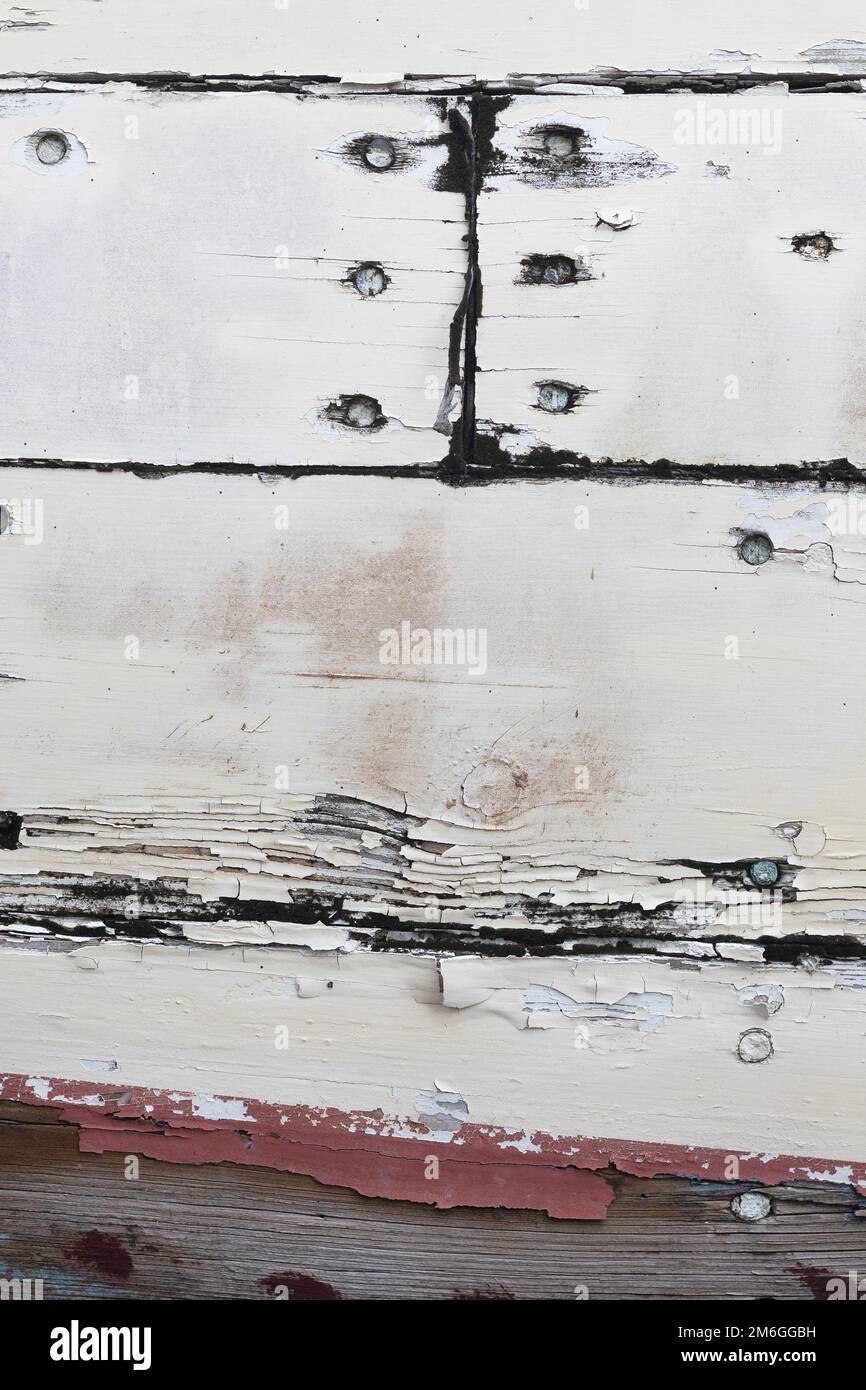 Close up of peeling paint on a wooden boat. Stock Photo