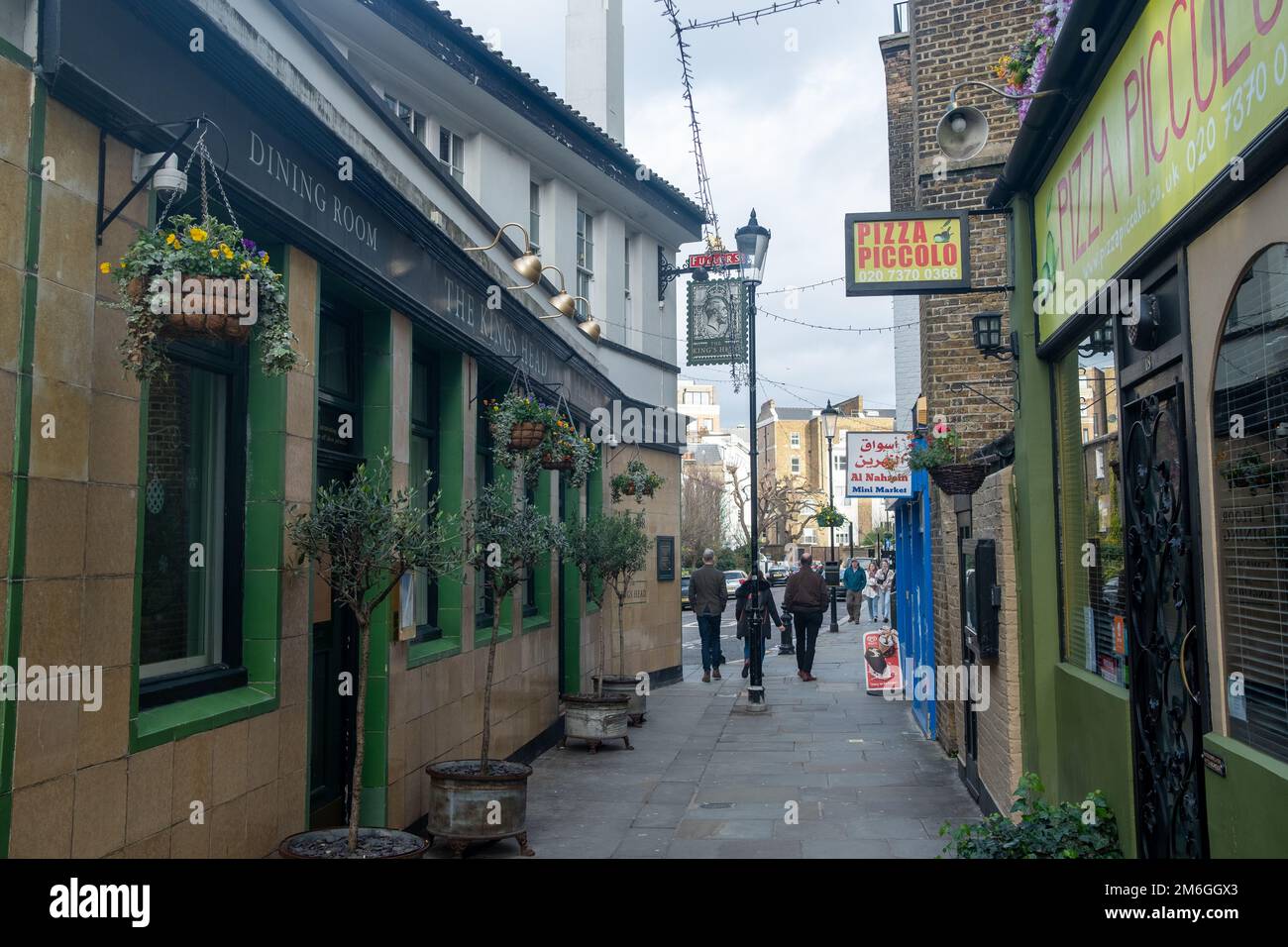 London- December 2022: Kings Head and shops on Hogarth Place in Earls Court Stock Photo