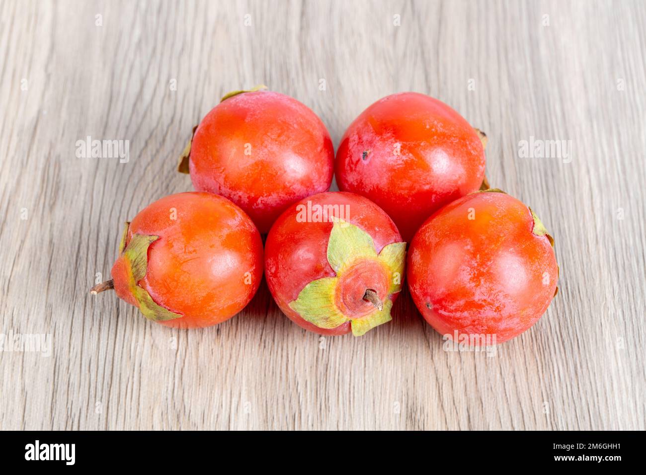 Ripe persimmon fruits isolated Stock Photo