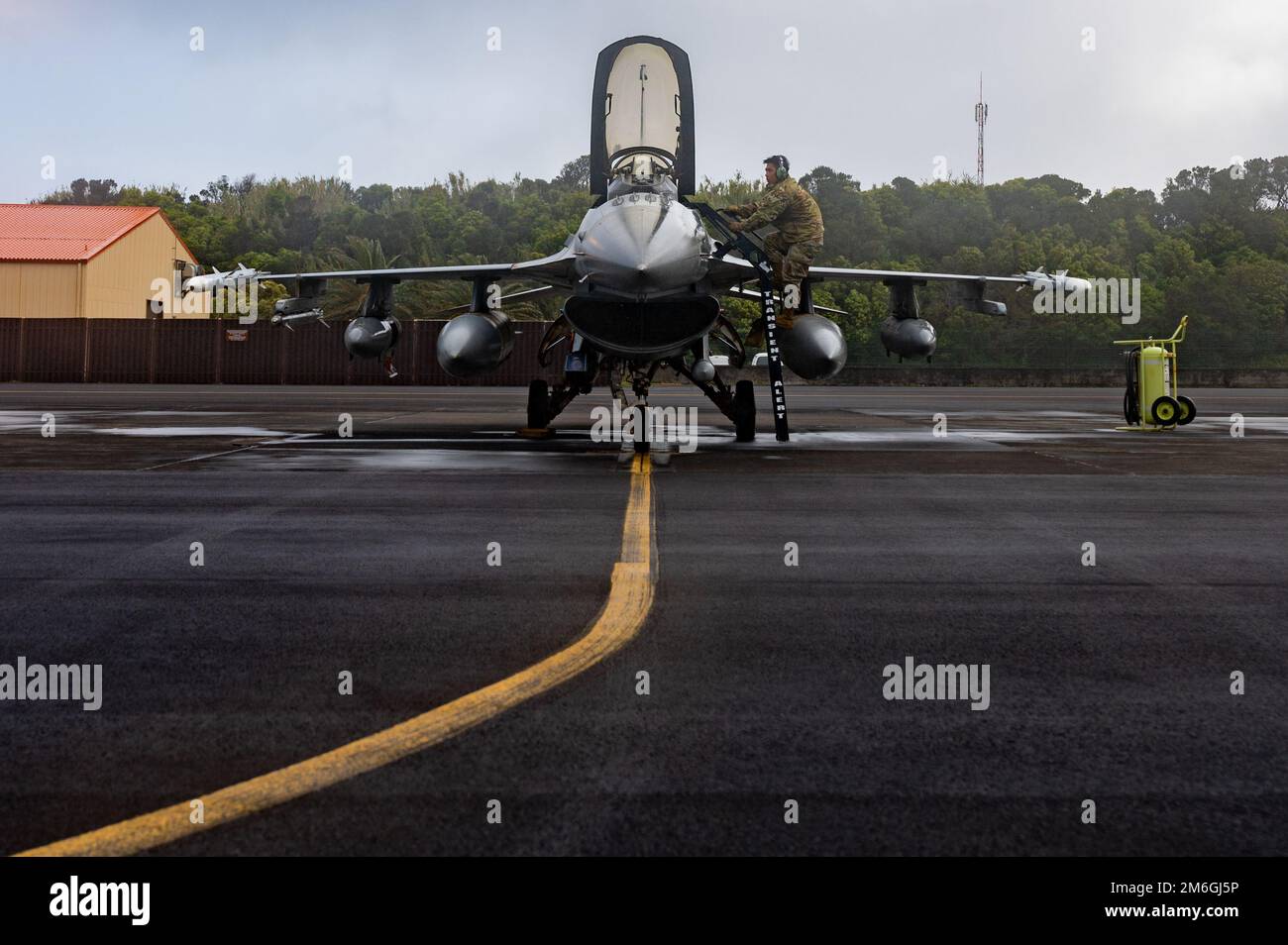 U.S. Air Force Master Sgt. James Thammavongsa, 65th Air Base Group quality assurance superintendent, prepares an F-16 Fighting Falcon aircraft assigned to Shaw Air Force Base, South Carolina, for launch during a coronet mission through Lajes Field, Azores, Portugal, April 27, 2022. The Lajes team provides critical ground maintenance support to multiple aircraft, from bombers and fighters to tankers and cargo. Stock Photo