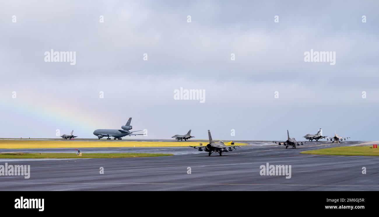 A coronet of six F-16 Fighting Falcon aircraft assigned to Shaw Air Force Base, South Carolina, and a KC-10 Extender aircraft assigned to McGuire Air Force Base, New Jersey, taxi to depart Lajes Field, Azores, Portugal, April 27, 2022. The 65th Air Base Group at Lajes, known as the “Crossroads of the Atlantic,” provides an important mid-Atlantic link for U.S. and Allied forces traveling to and from Europe, Africa and the Middle East. Stock Photo