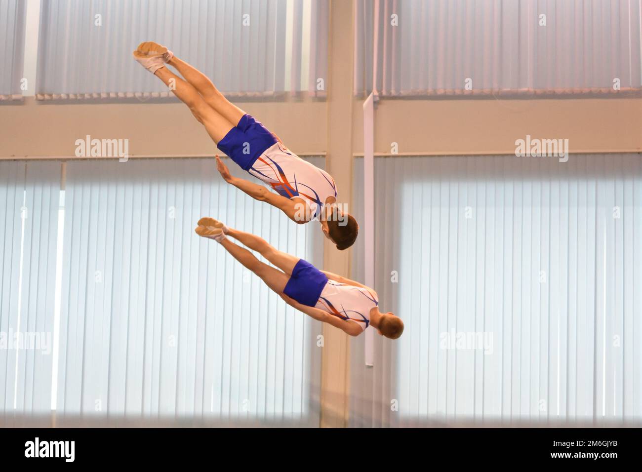 Synchronized Jump Roping Two boys train in synchronized jumping on a trampoline Stock Photo - Alamy