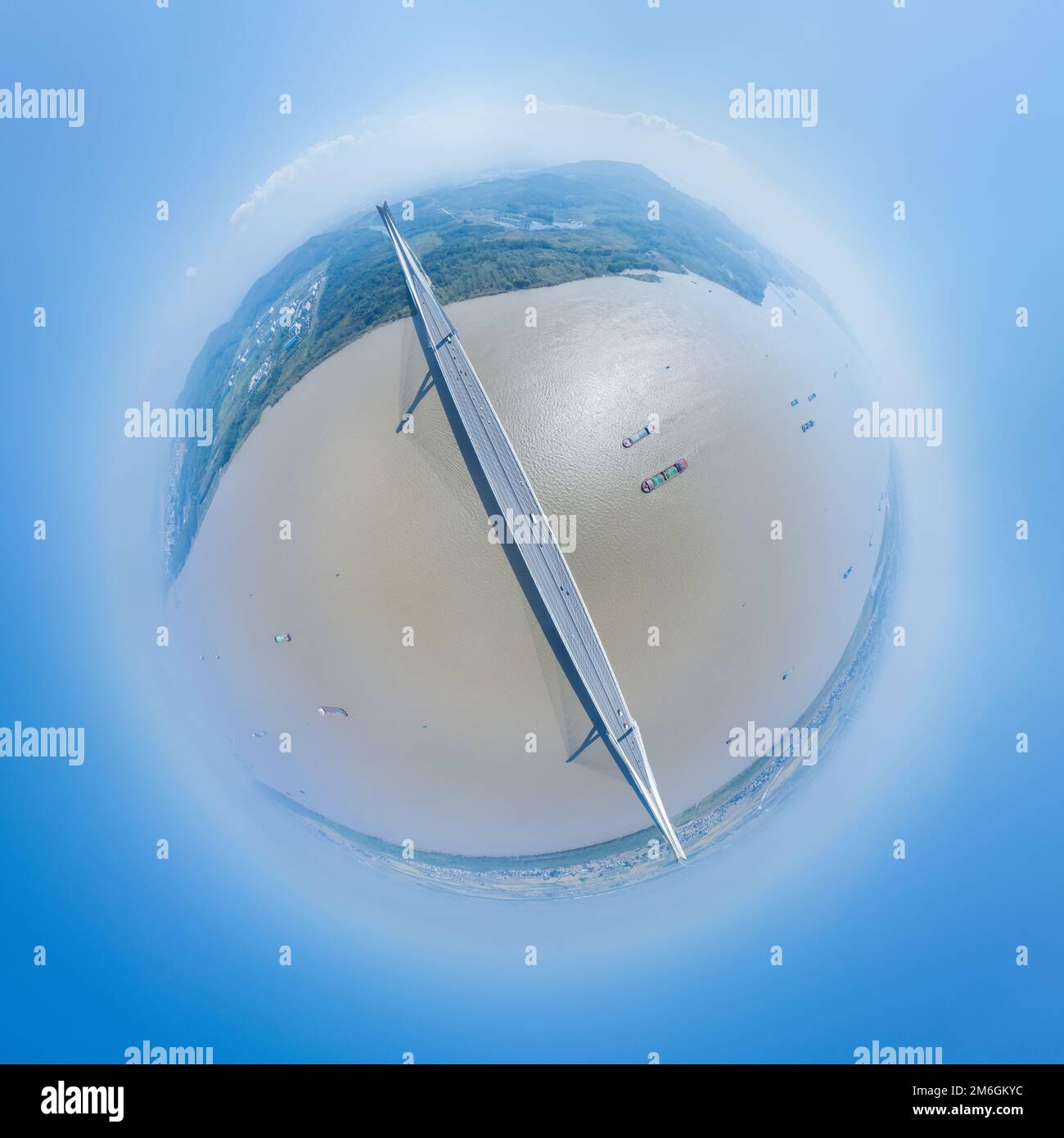 Little planet image of cable-stayed bridge over river Stock Photo