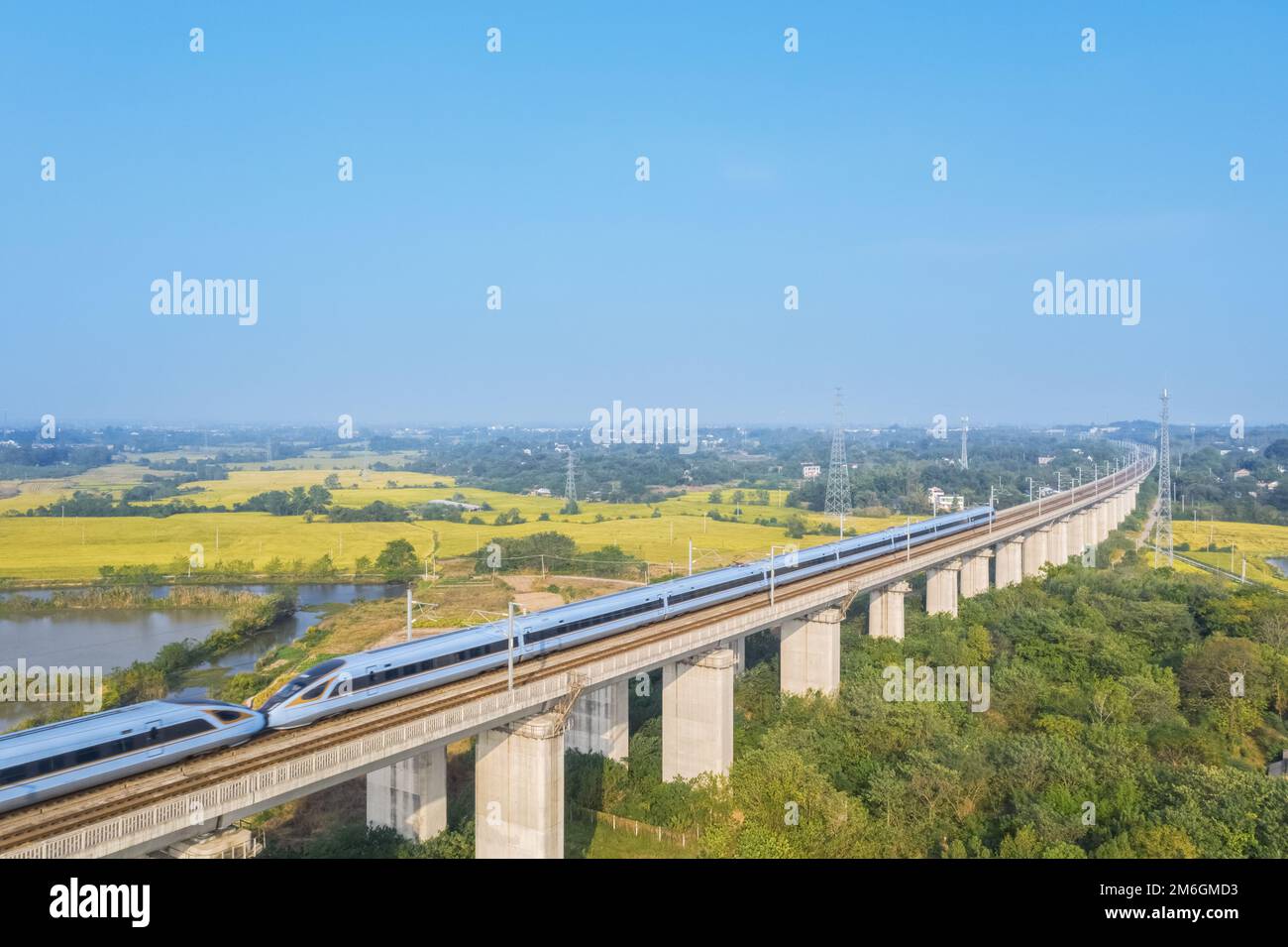 Aerial view of high speed trains in rural autumn landscape Stock Photo