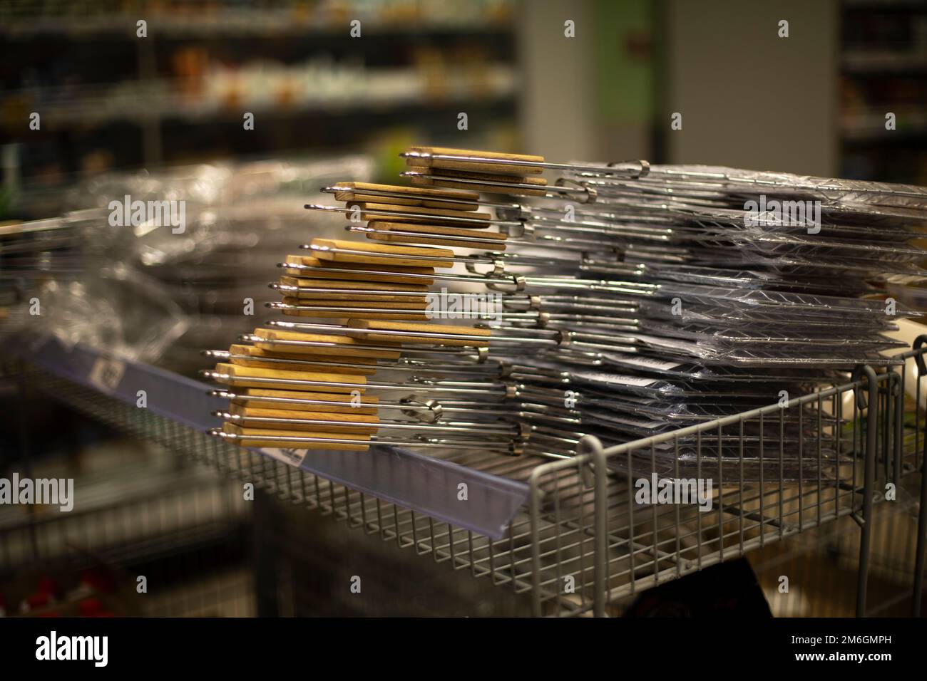 Grill grills. Sale of goods in store. Grill in market. Steel meshes on market. Stock Photo