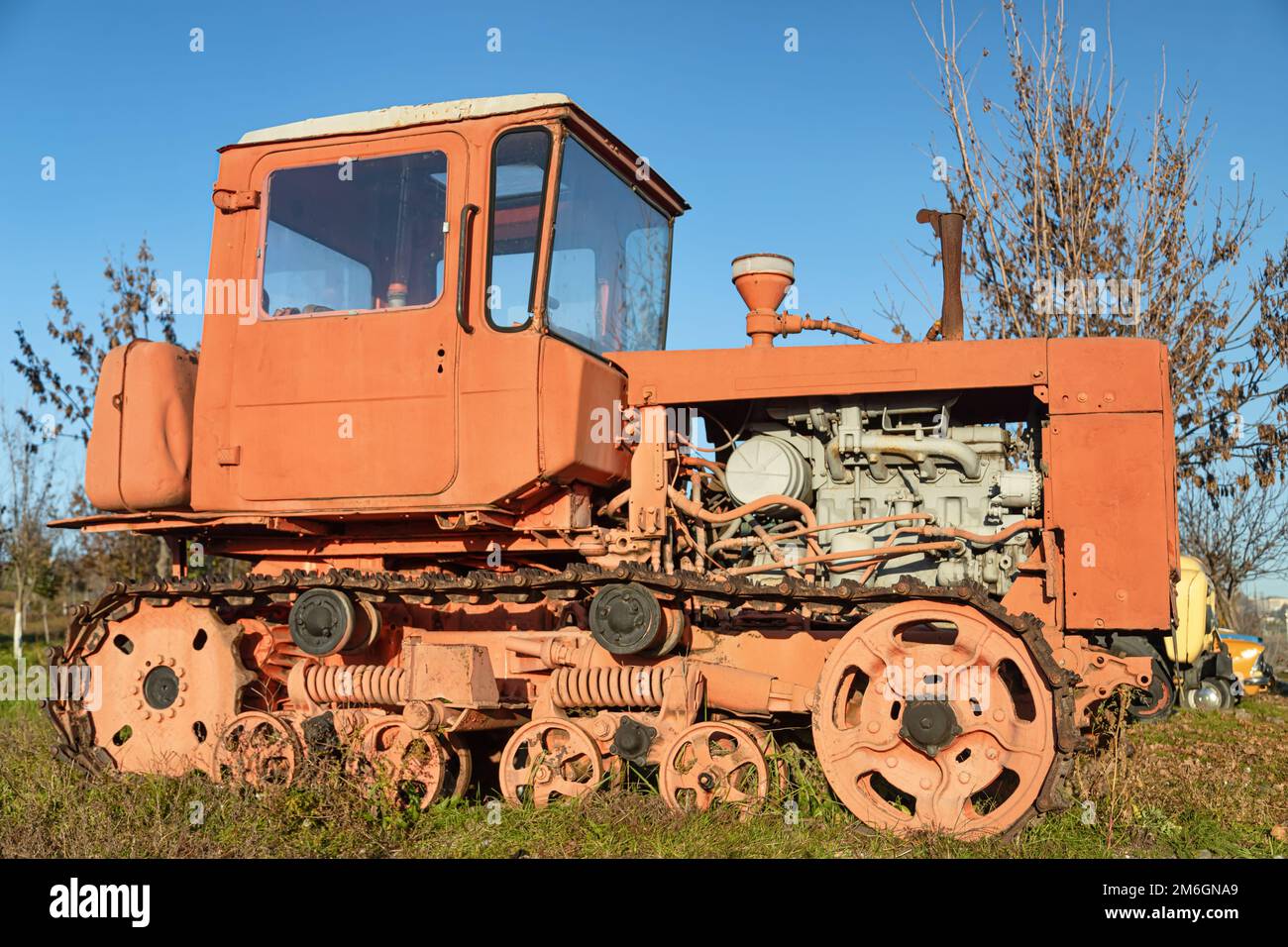An old tracked agricultural red tractor made in USSR Stock Photo Alamy