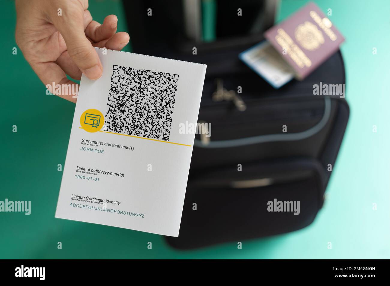 Woman showing EU Covid Certificate with quad code Stock Photo - Alamy