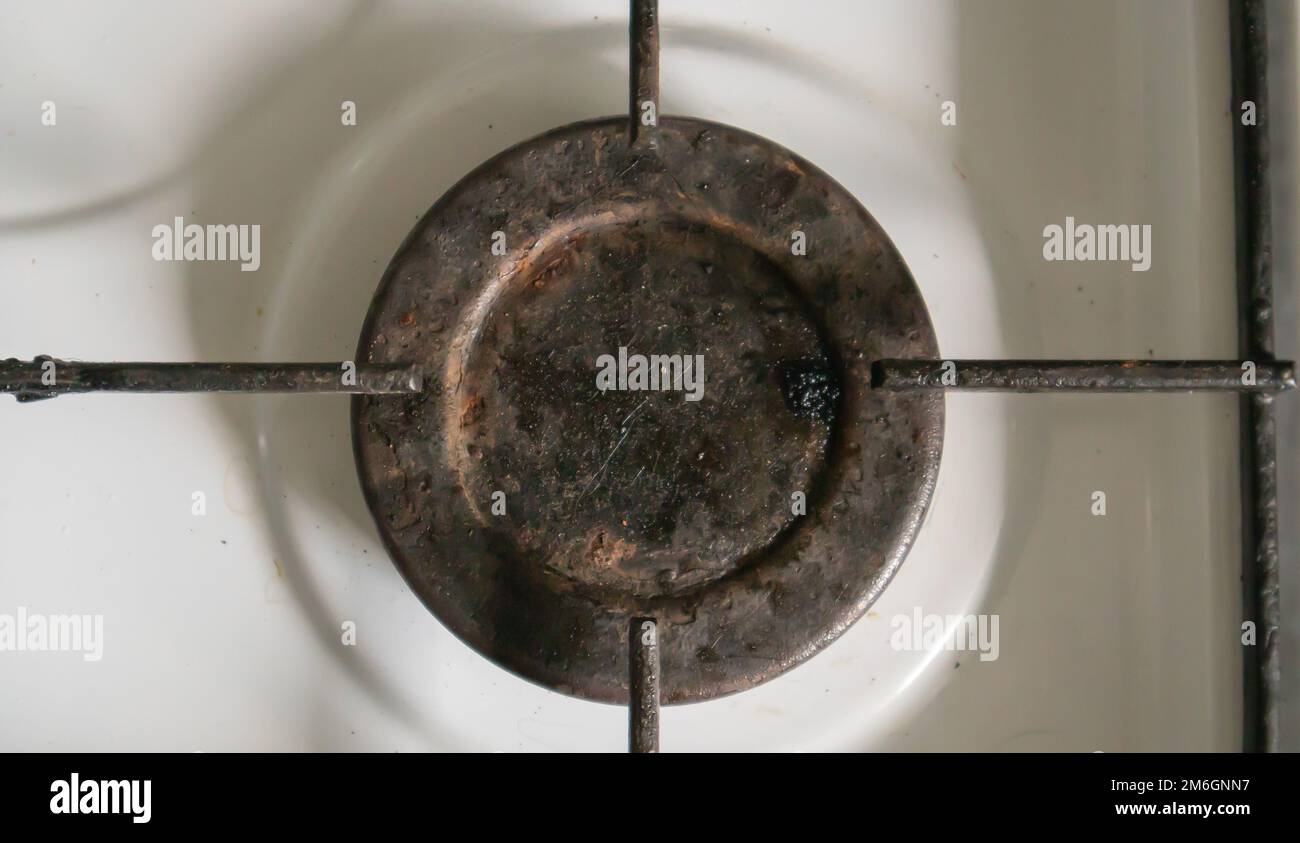Dirty gas stove in the kitchen for cooking with vegetable oil stains