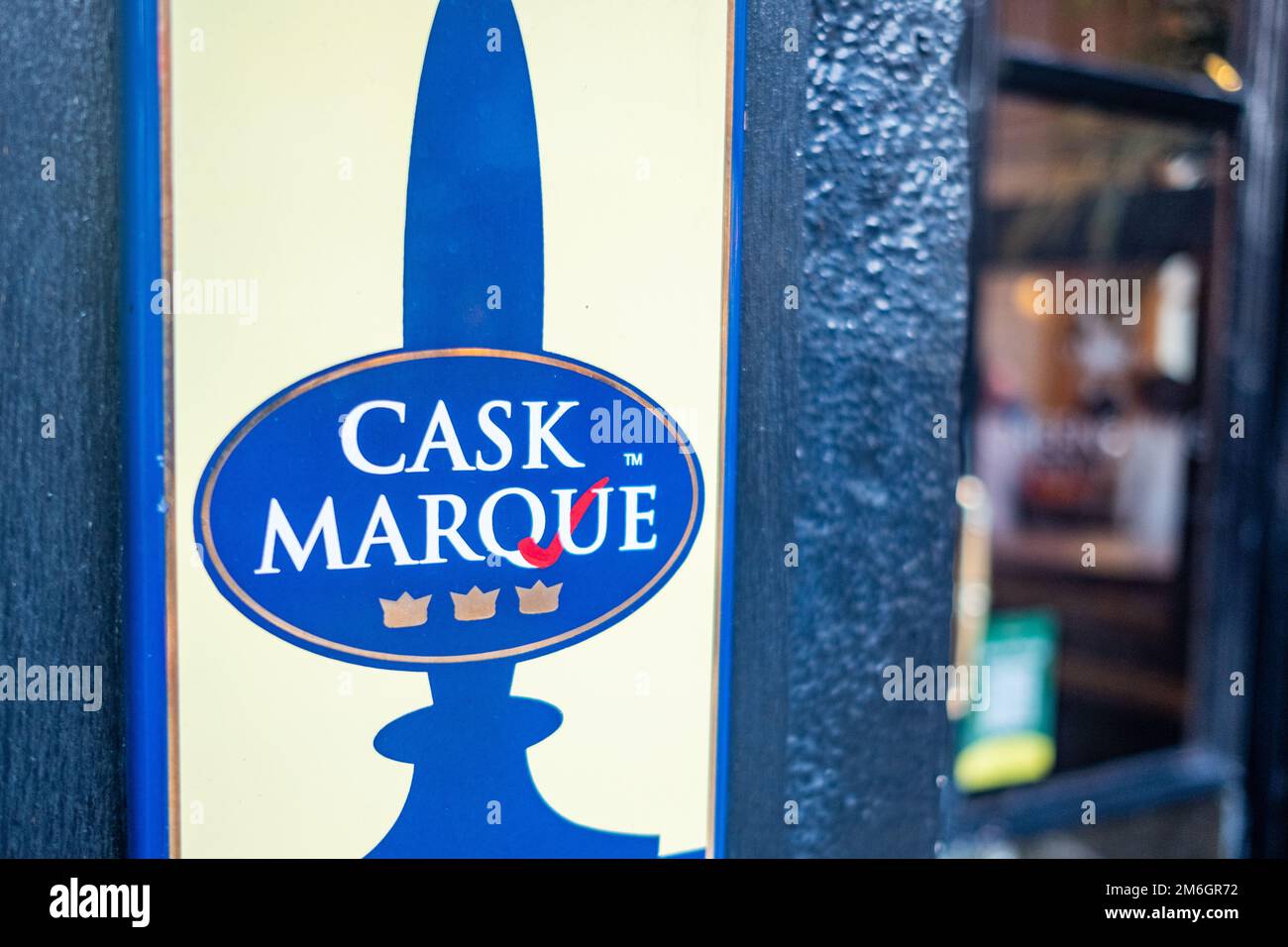 London December 2022: Cask Marque Trust sign on Greene King pub in Earls Court Kensington London December 2022: Cask Marque Trust sign on Greene King pub in Earls Court Kensington