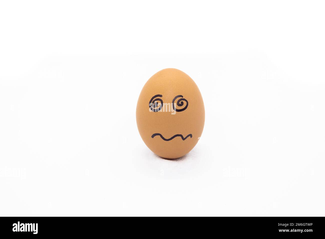 Egg with confused face on white background Stock Photo