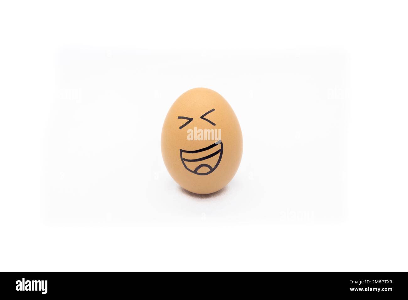 Egg with very happy face on white background Stock Photo