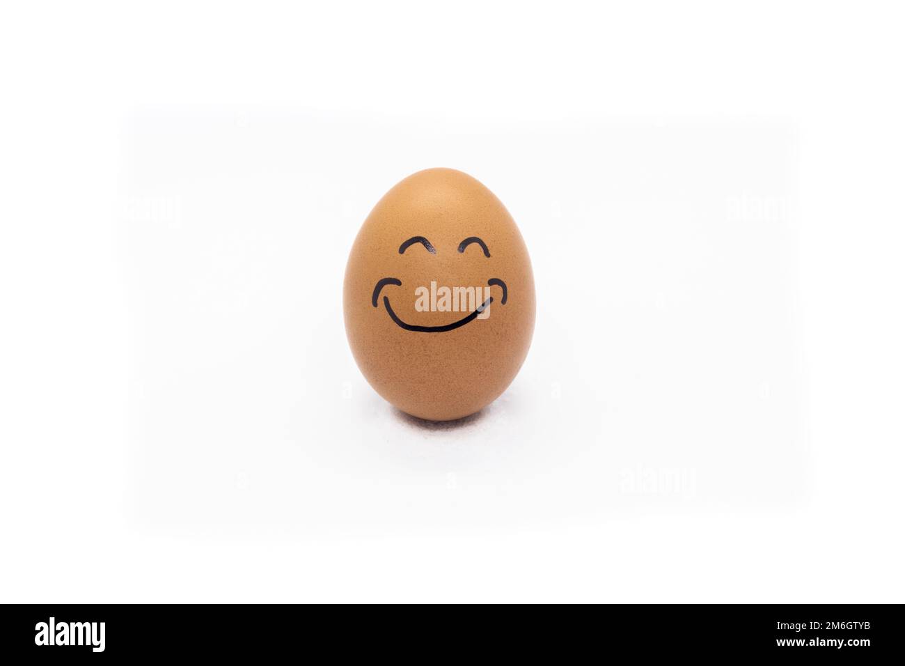 Egg with a big smile on white background Stock Photo