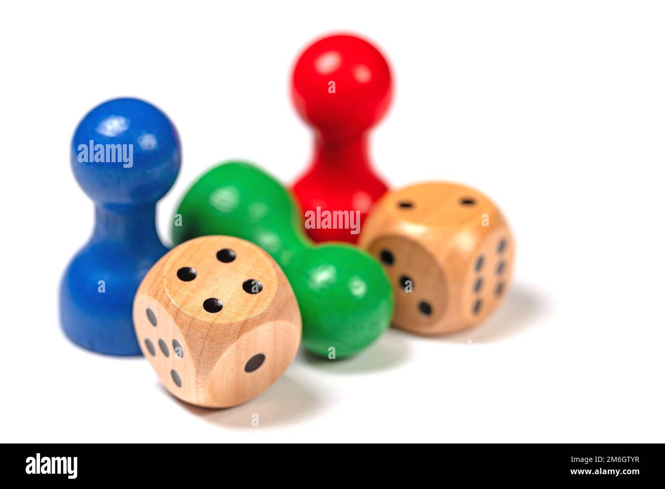 Colorful game pieces and dice close-up Stock Photo