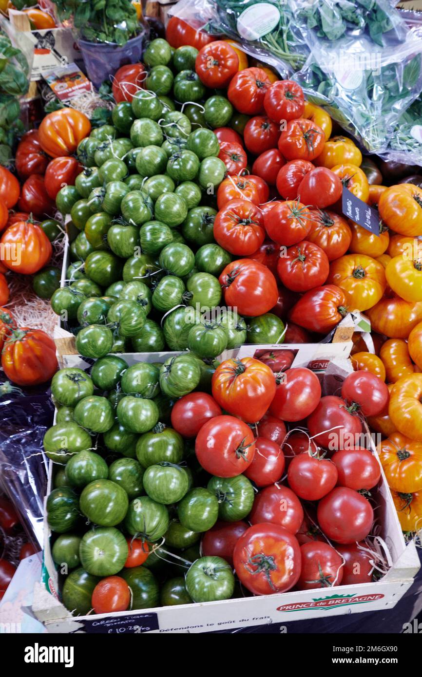 Fresh vibrant ripe tomatoes on sale in a market Stock Photo