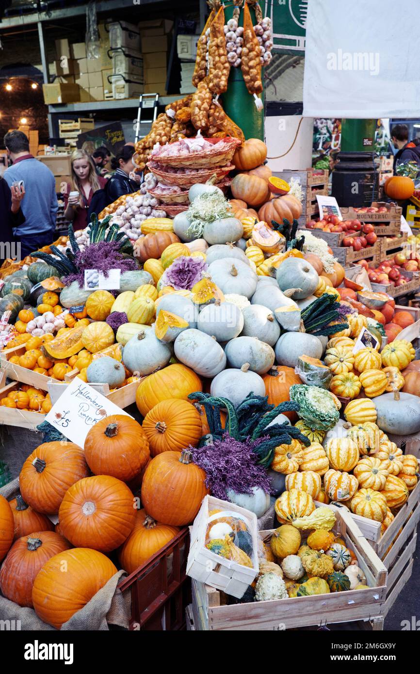 Fresh vibrant ripe pumpkins and squash on sale in a market Stock Photo