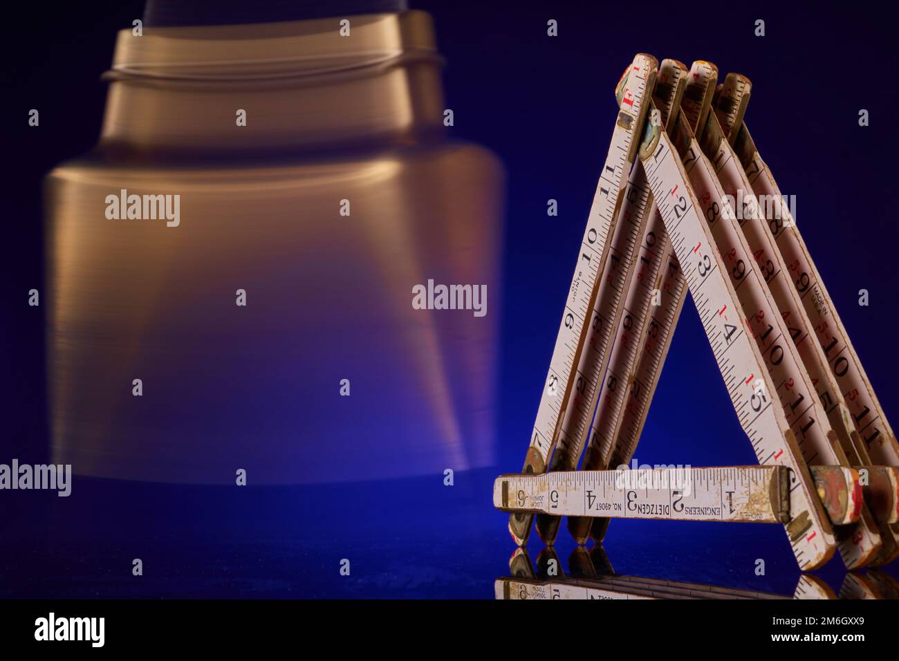 Plumb bob & carpenter's scale, antique surveying equipment Stock Photo