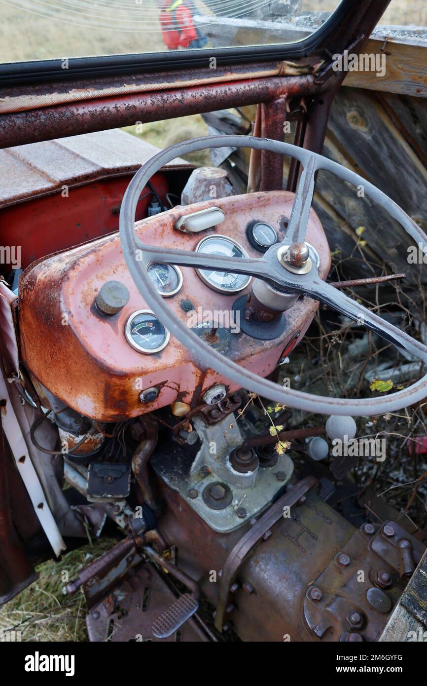 Steering wheel and instruments on an old tractor Stock Photo