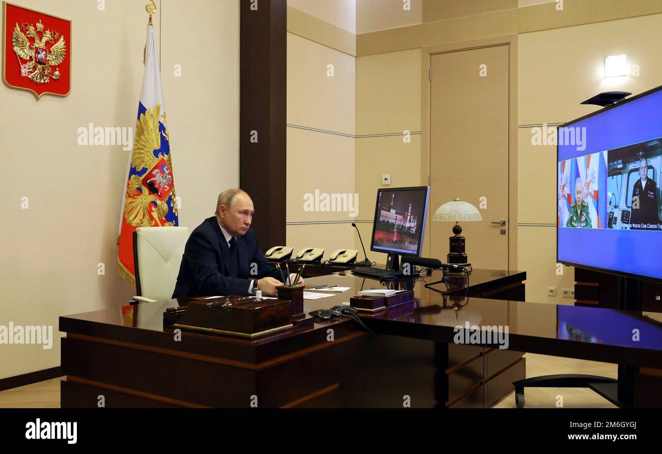 Novo-Ogaryovo, Russia. 04th Jan, 2023. Russian President Vladimir Putin takes part in a video conference with Defence Minister Sergei Shoigu and Commander of the Admiral Gorshkov frigate Igor Krokhmal before a ceremony to launch of the warship on the first deployment, from the official residence of Novo-Ogaryovo, January 4, 2023 in Novo-Ogaryovo, Moscow Region, Russia. Credit: Mikhail Klimentyev/Kremlin Pool/Alamy Live News Stock Photo