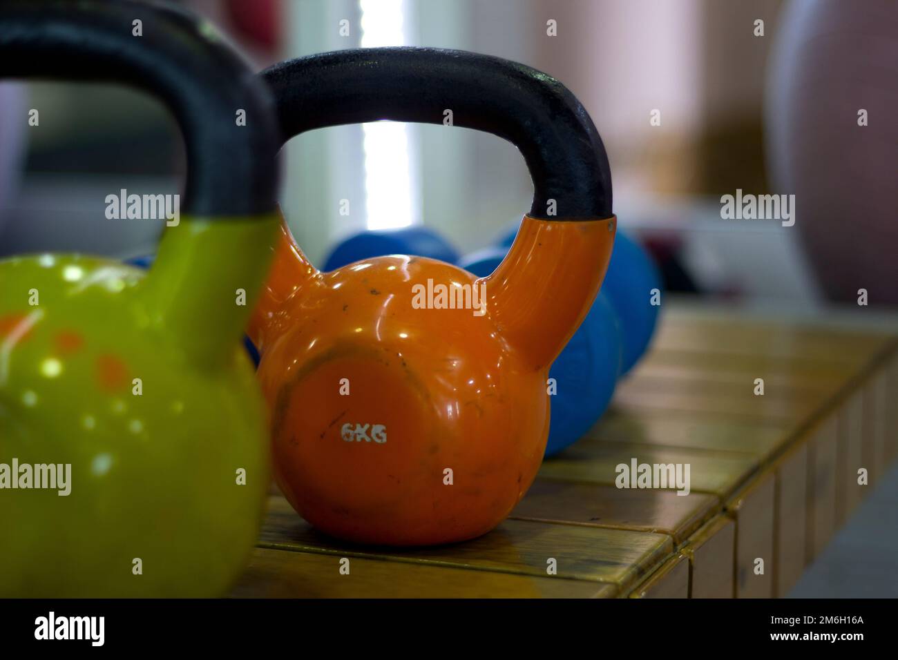 Cast iron weightlifting fitness weights arranged inside a fitness