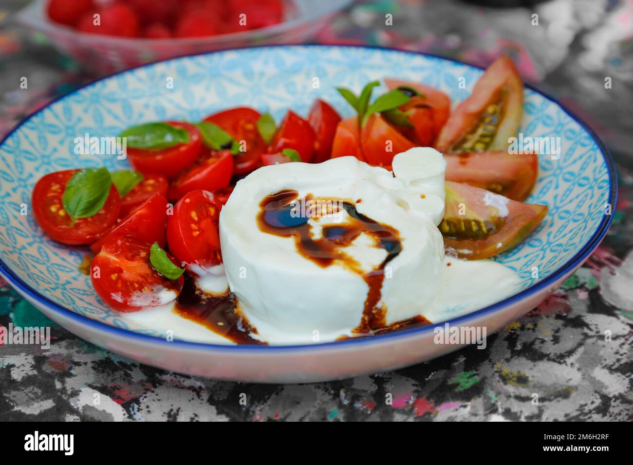 Tomatoes with basil and buffalo mozzarella, balsamic vinegar, healthy, vegetables, salad, caprese, vegetarian, plate, food photography, Germany Stock Photo