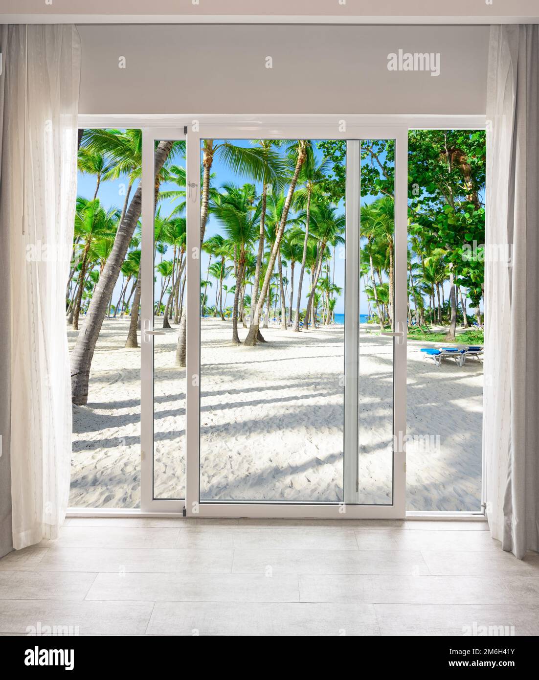 Large glass door overlooking the beach Stock Photo