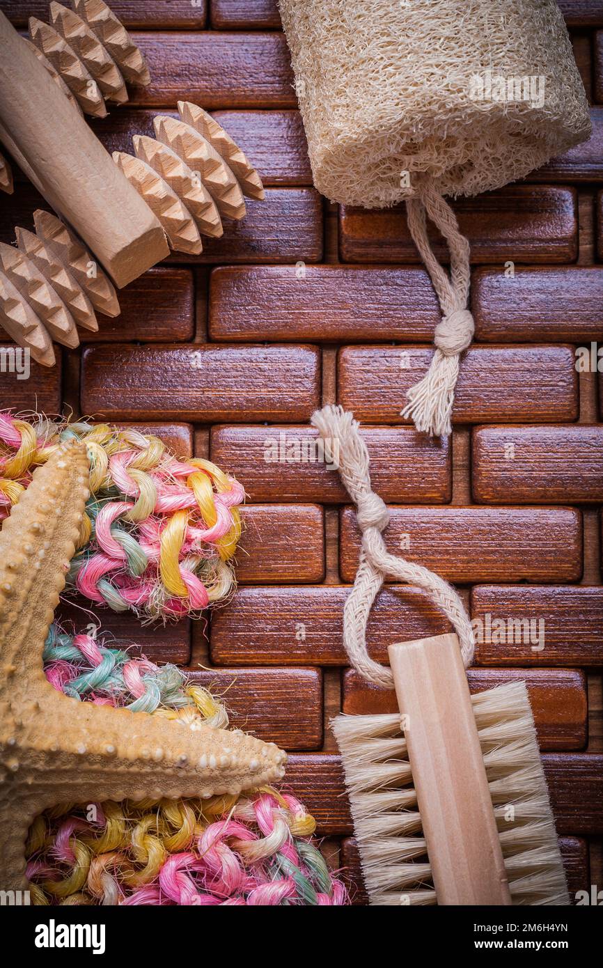 Collection of bath accessories on checked wooden table mat healthcare