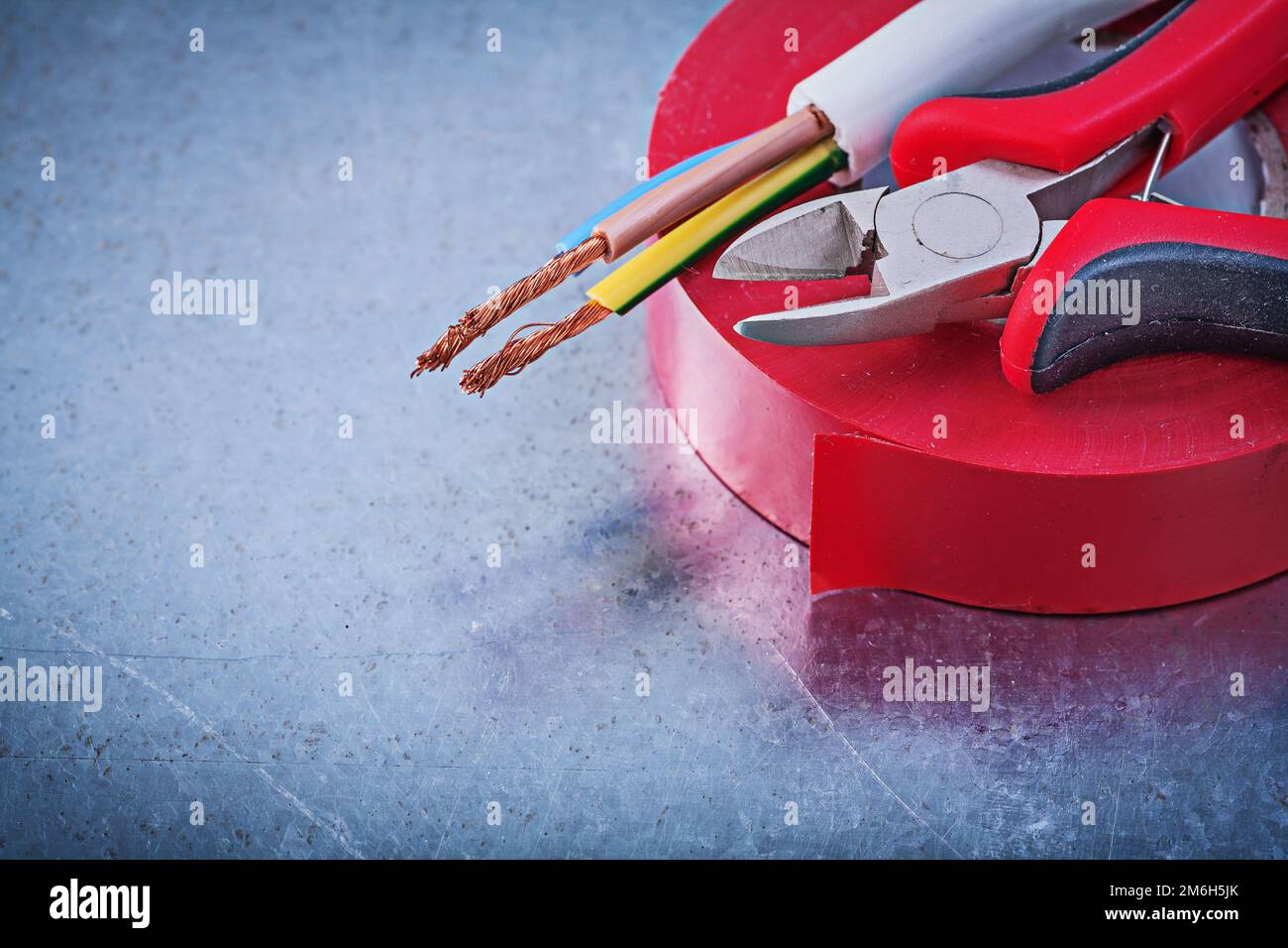 Insulating tape cutting pliers electric wires construction concept