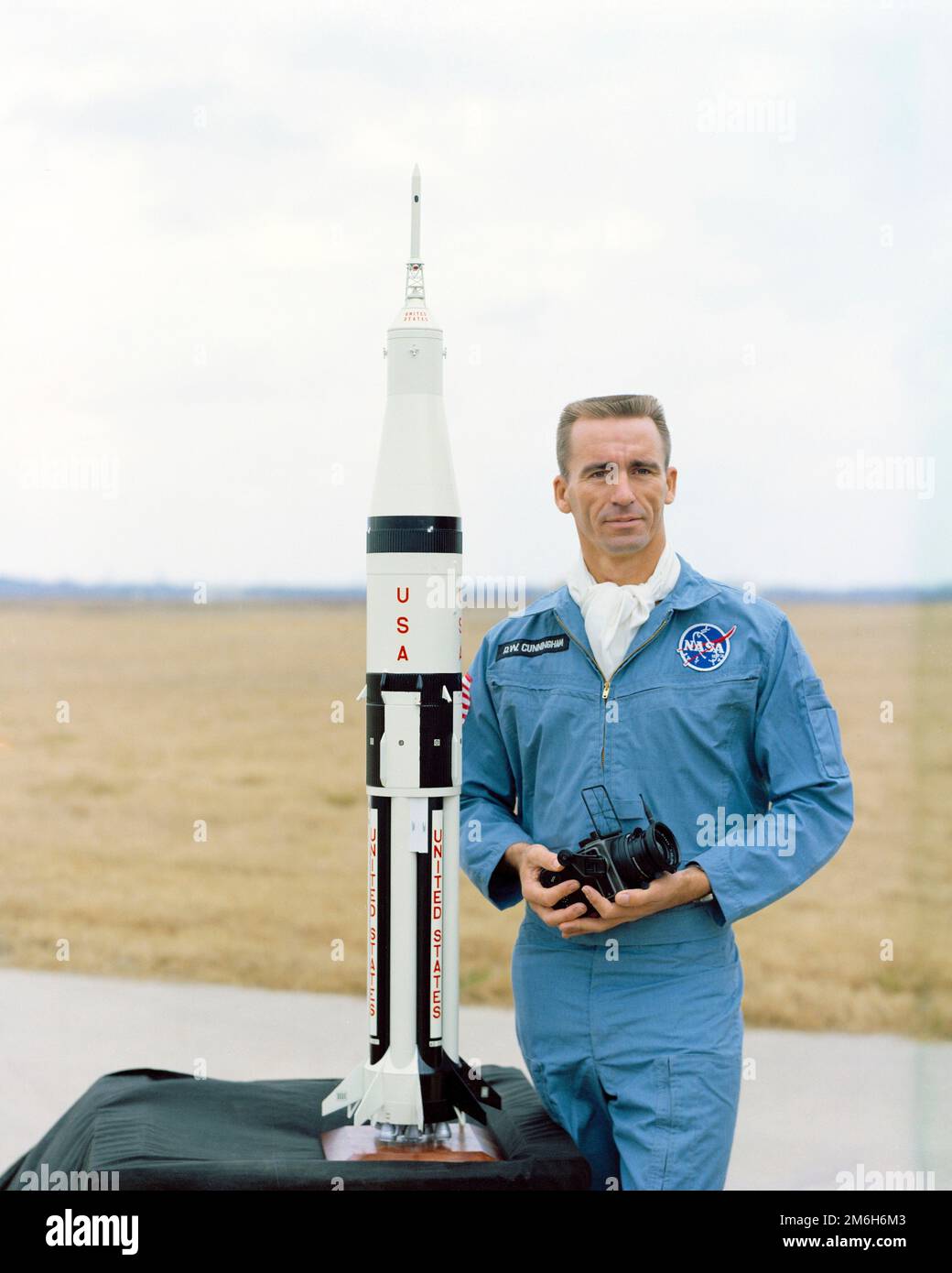 Cape Canaveral, United States. 13 February, 1968. NASA astronaut Walter Cunningham, lunar module pilot for the Apollo 7 mission poses with a model of the Apollo 7 Lunar Module and Saturn rocket ship at the Kennedy Space Center, February 13, 1968 in Cape Canaveral, Florida. Cunningham died January 4, 2023 at 90-years-old, the last surviving member of the NASA Apollo 7 mission. Stock Photo