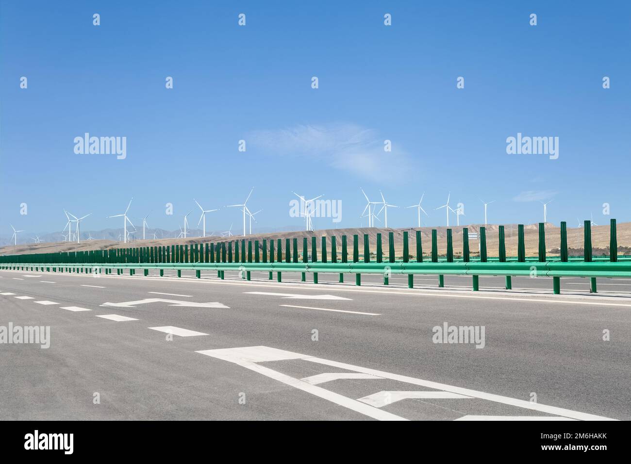 Modern highway with wind farm Stock Photo