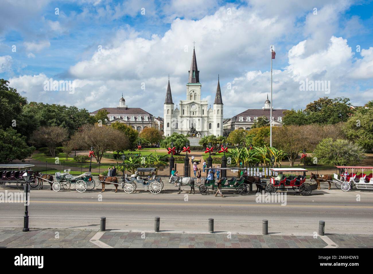 Old horse carts before Jackson square and the St. Louis Cathedral, French quarter, New Orleans, Louisiana, USA Stock Photo