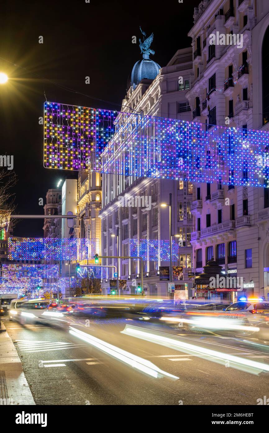 Night view of Gran Via adorned with Christmas lights, Madrid Spain