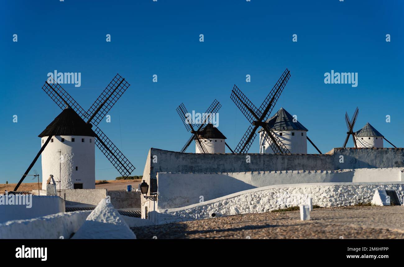 Windmills array under clear blue sky for text Stock Photo