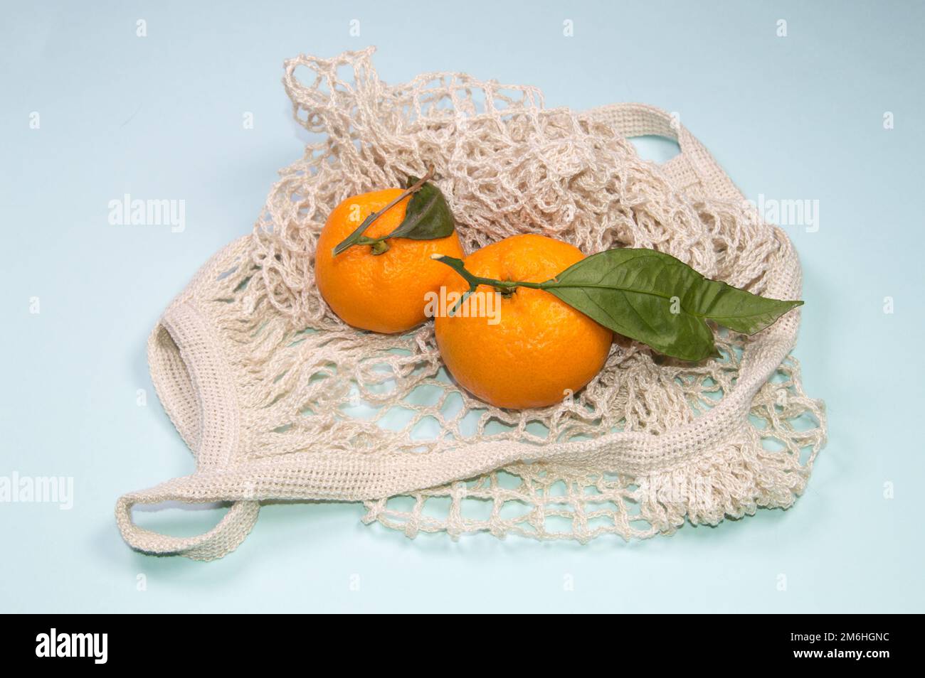 Fresh tangerines in a netted bag, Stock image
