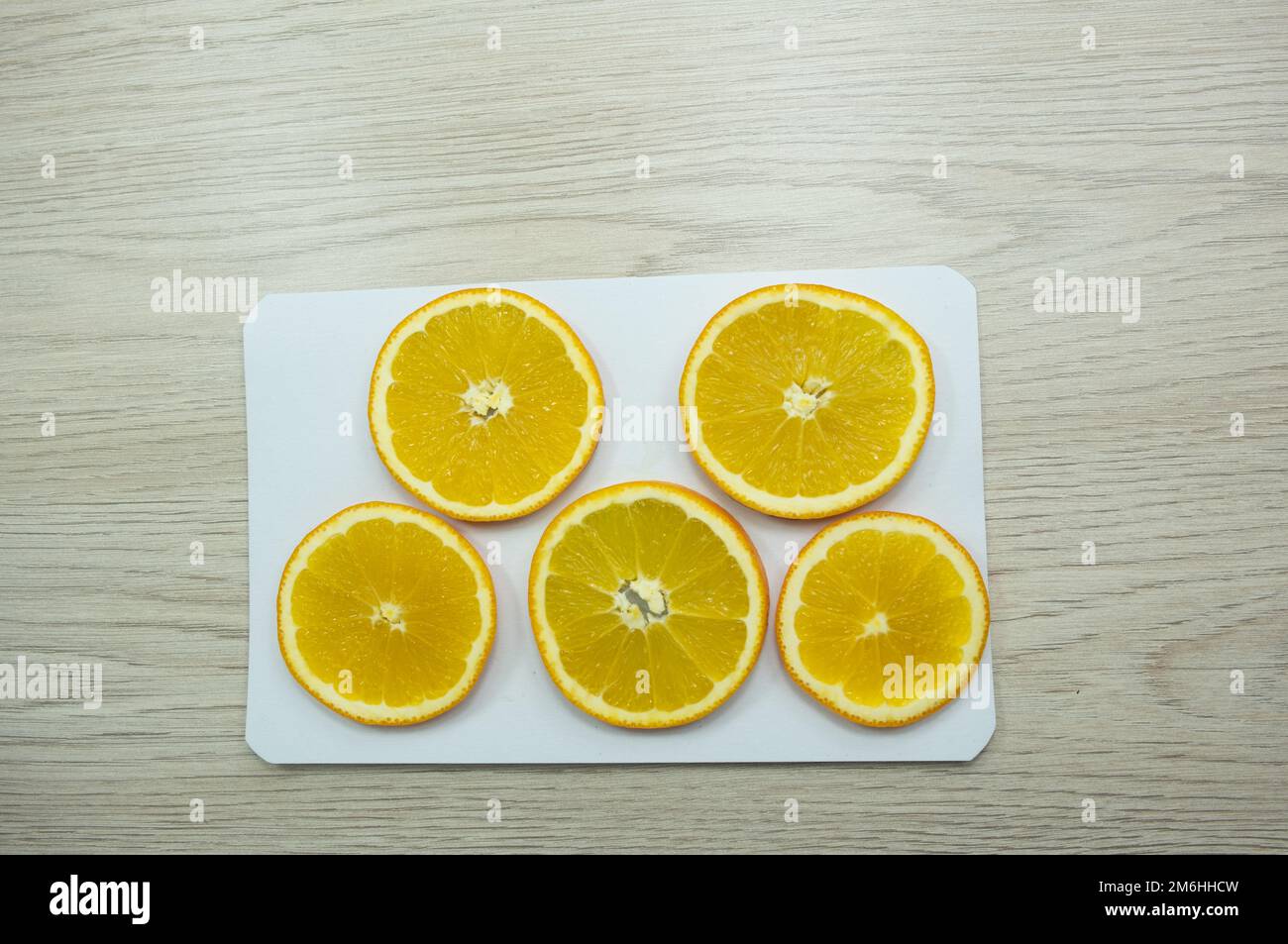 Sliced oranges for drying on paper Stock Photo