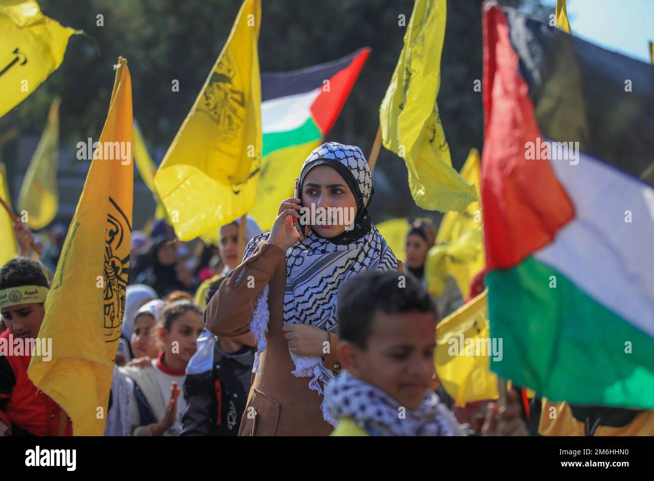 Palestinians attend a rally marking the 58th anniversary of the Fatah