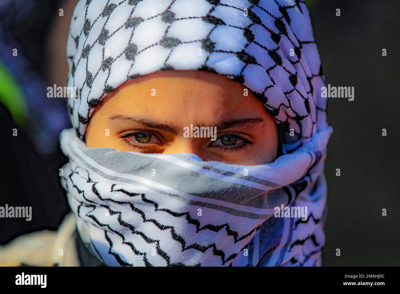 Palestinians attend a rally marking the 58th anniversary of the Fatah