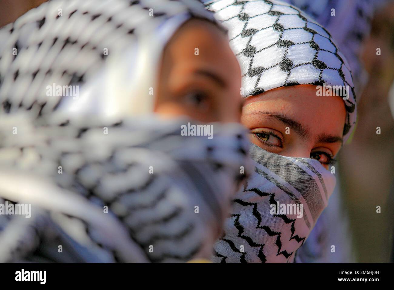 Palestinians attend a rally marking the 58th anniversary of the Fatah